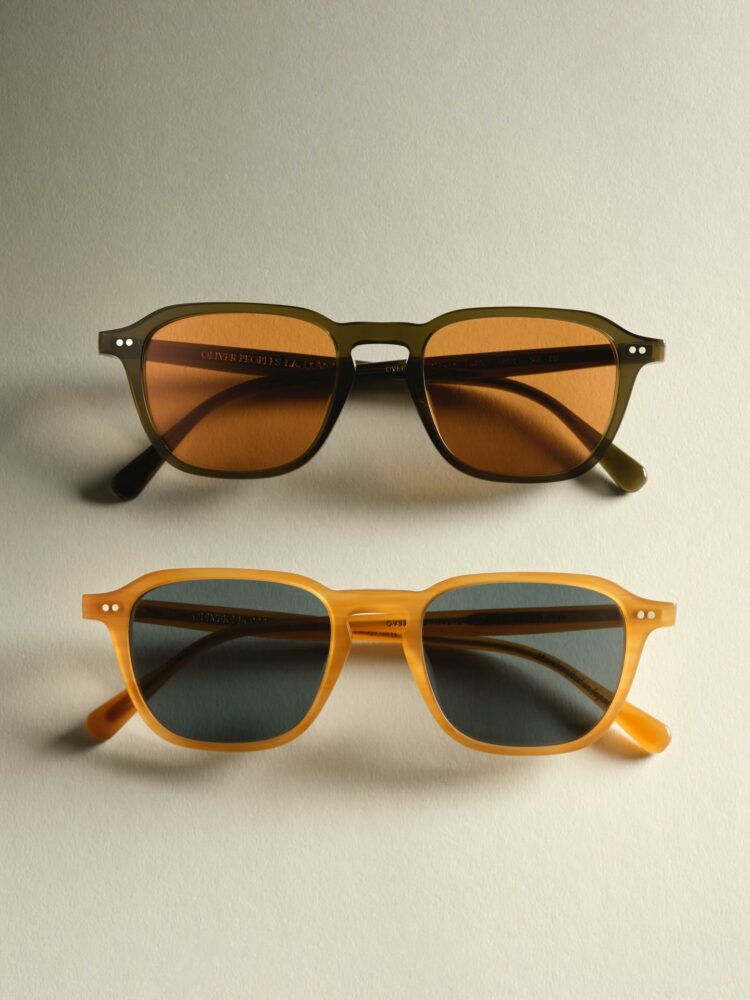 Two sunglasses on a light background; top olive frame with orange lenses, bottom yellow frame with dark lenses.