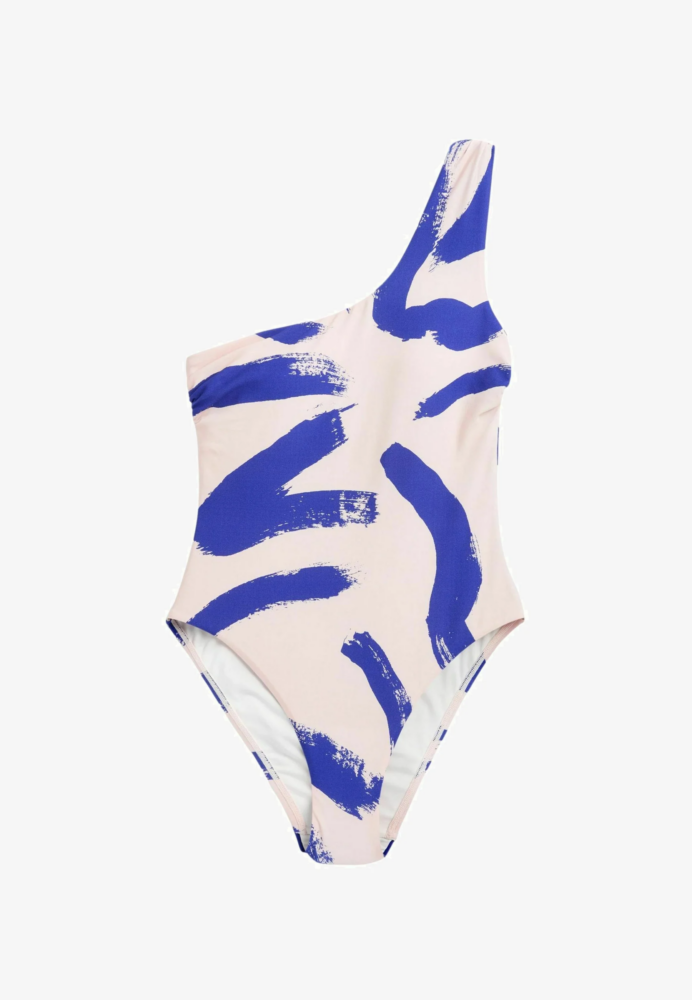 One-shoulder pink swimsuit with a bold blue abstract brushstroke pattern.