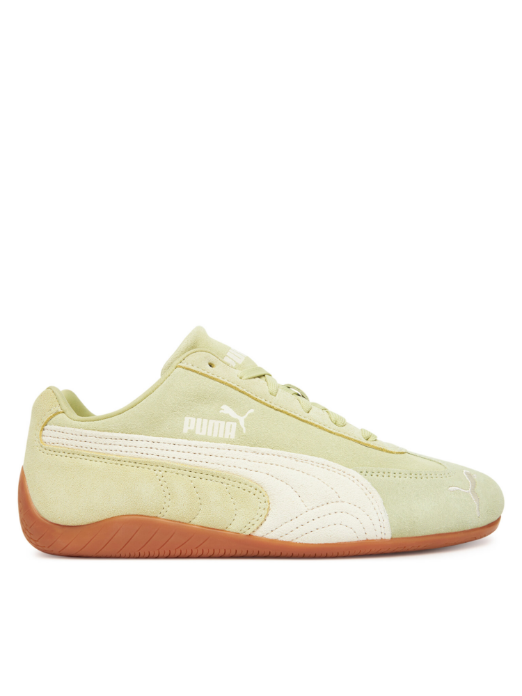 Beige Puma sneaker shown from a low side angle with white stripe and tan sole visible.