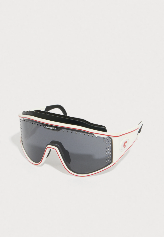 Snow goggles with dark lenses, white frame, red trim, Carrera branding visible on the side panel.