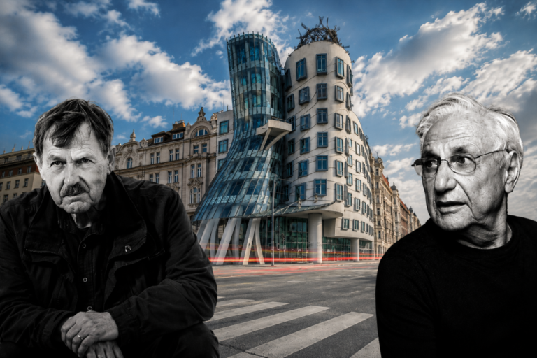 Two older men in dark clothing sit at a crosswalk in front of Prague's iconic Dancing House against a blue sky with clouds.