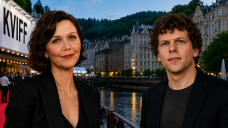 Two well-dressed people posing on a red carpet by a river with European-style buildings in the background, at dusk/summer evening event: woman on left, man on right.