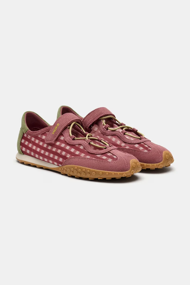 Pair of pink hiking shoes with plaid side panels, gum sole, and olive heel accent.