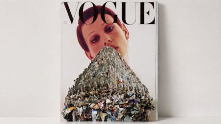 Vogue magazine cover featuring a woman's face with a large sculpture made of shredded colorful paper covering her chest and shoulders.